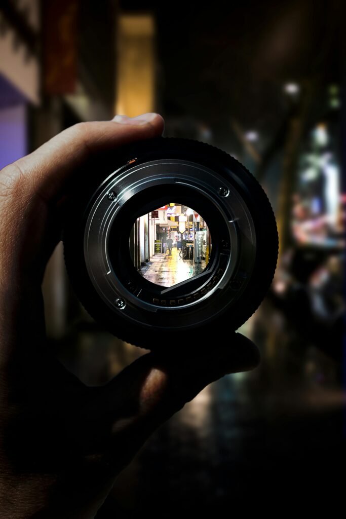 A unique perspective of Düsseldorf's city streets seen through a camera lens at night.